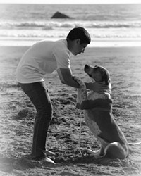 PURE Love, Always captures a tender moment between photographer Trisha Butcher's son and dog.