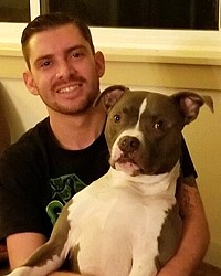 DEADLY SHOOTING Bubbs, a 7-year-old pit bull-boxer mix, was shot and killed by a SLO police officer on Sept. 26. His owners, Nick Regalia (pictured) and Riley Manford, plan to sue the city in response.