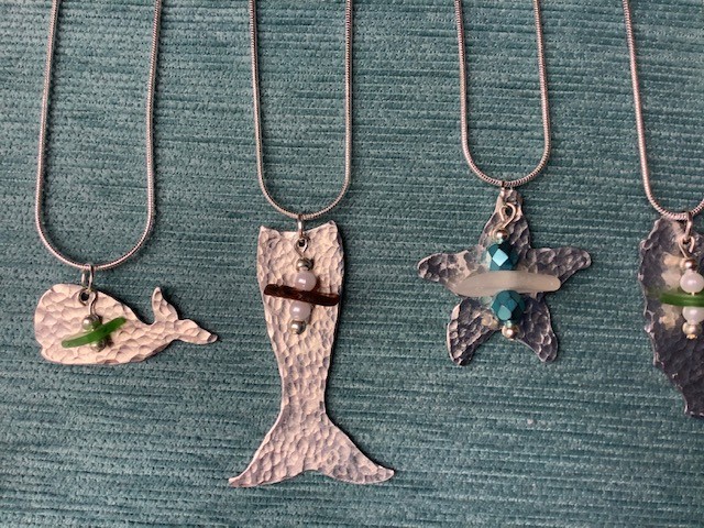 Learn how to texturize metal and drill holes in sea glass.