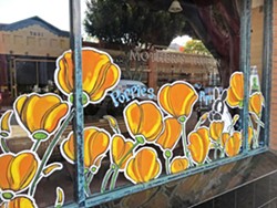 PHOTO BY PETER JOHNSON - INJECTING LIFE More than 70 businesses in downtown San Luis Obispo, including Mother's Tavern (pictured), are participating in the May Flower Initiative, a public art project launched to enliven downtown.